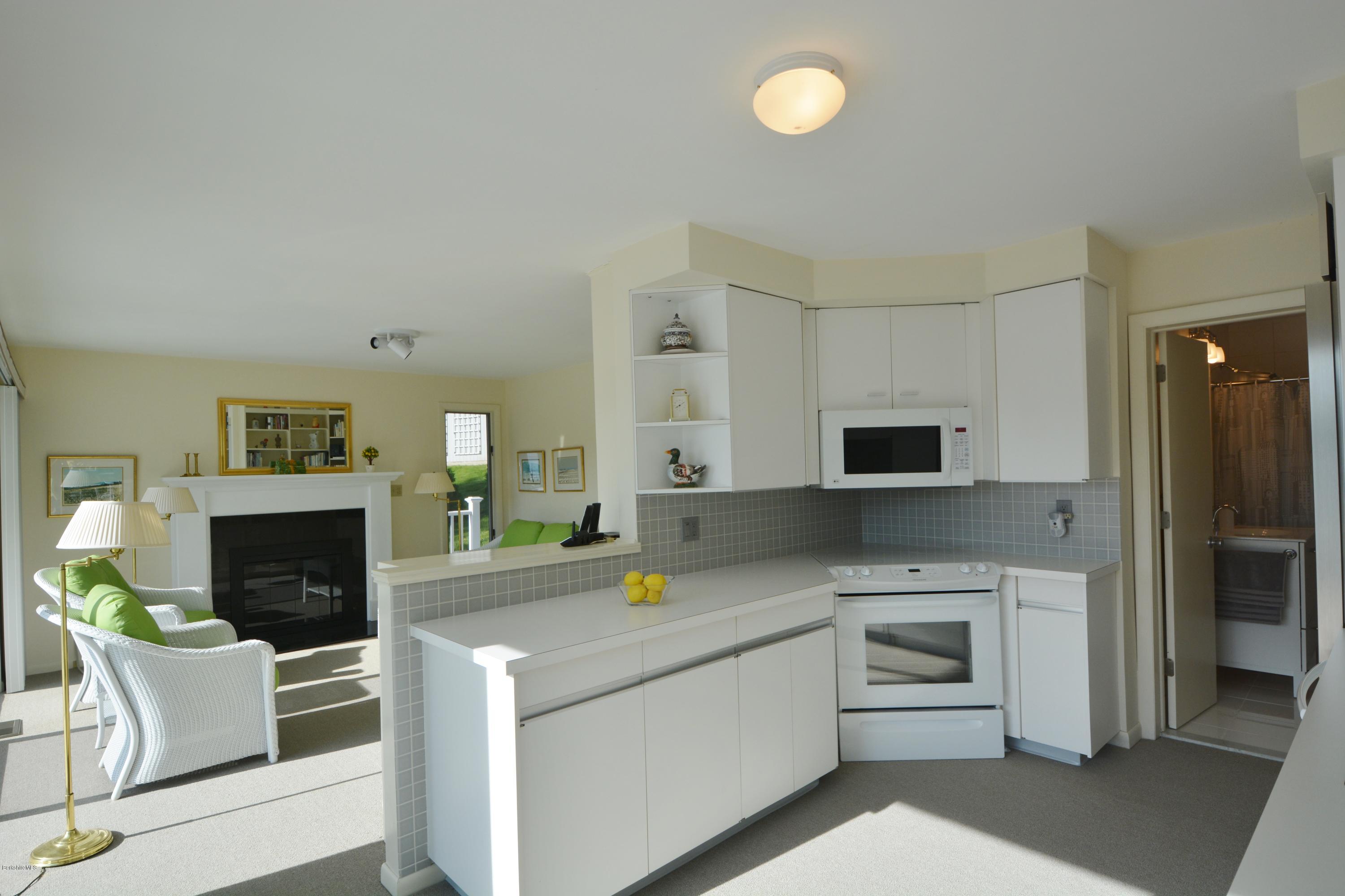 633 Pine Road Otis, MA 01029 - Photo 13 of 24 a kitchen with a sink cabinets and stainless steel appliances