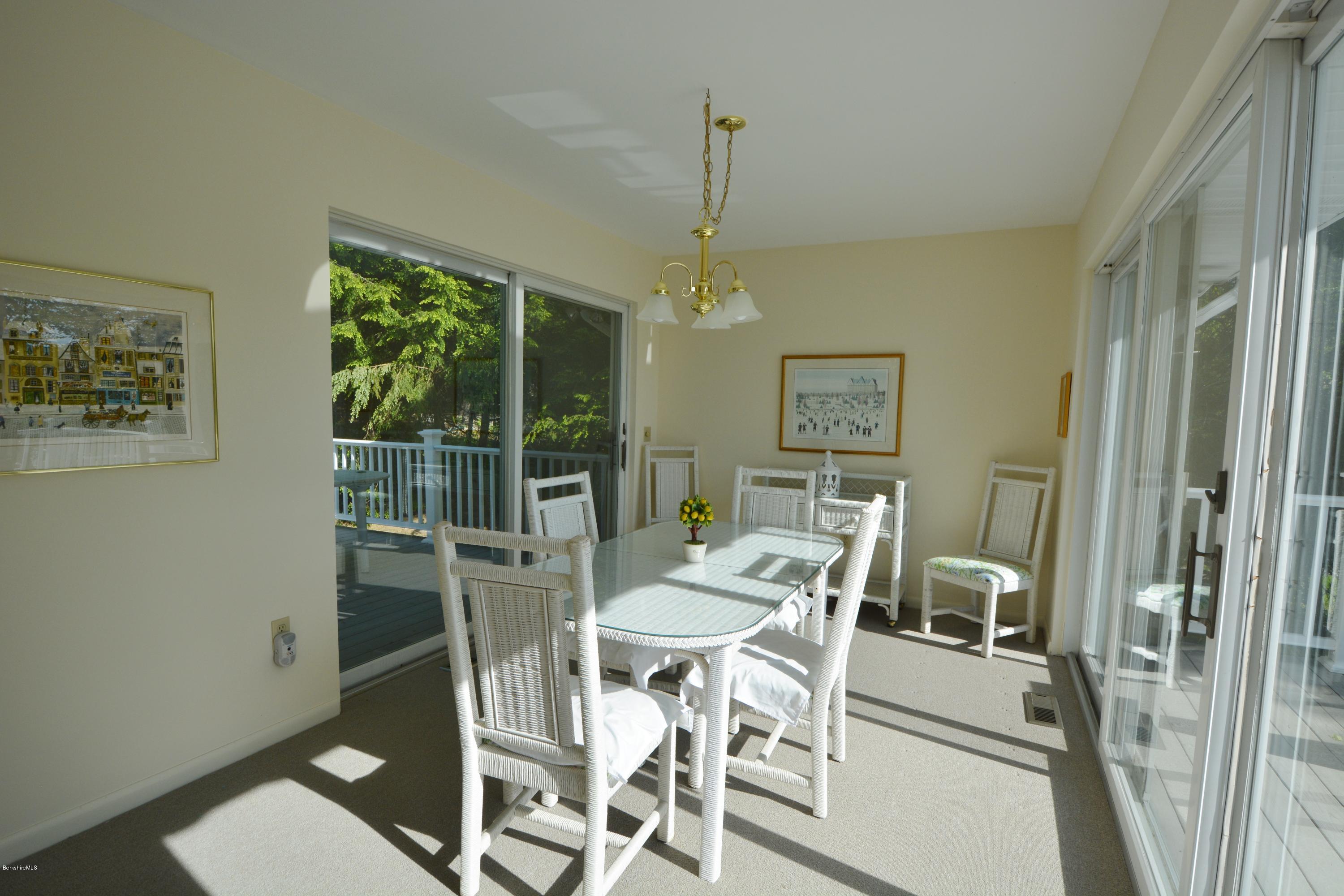 633 Pine Road Otis, MA 01029 - Photo 15 of 24 a view of a dining room with furniture window and outside view