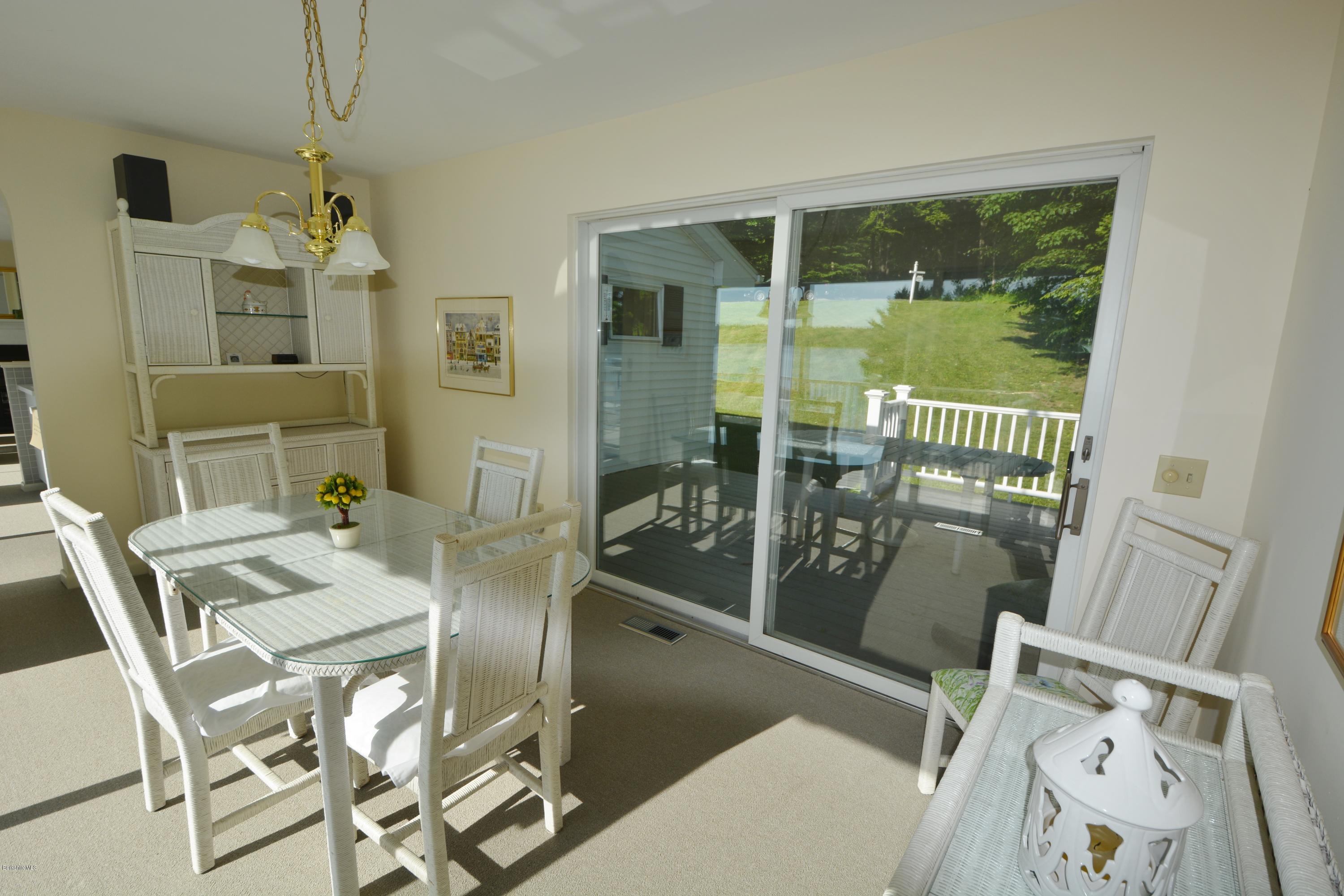 633 Pine Road Otis, MA 01029 - Photo 16 of 24 a view of a dining room with furniture window and outside view