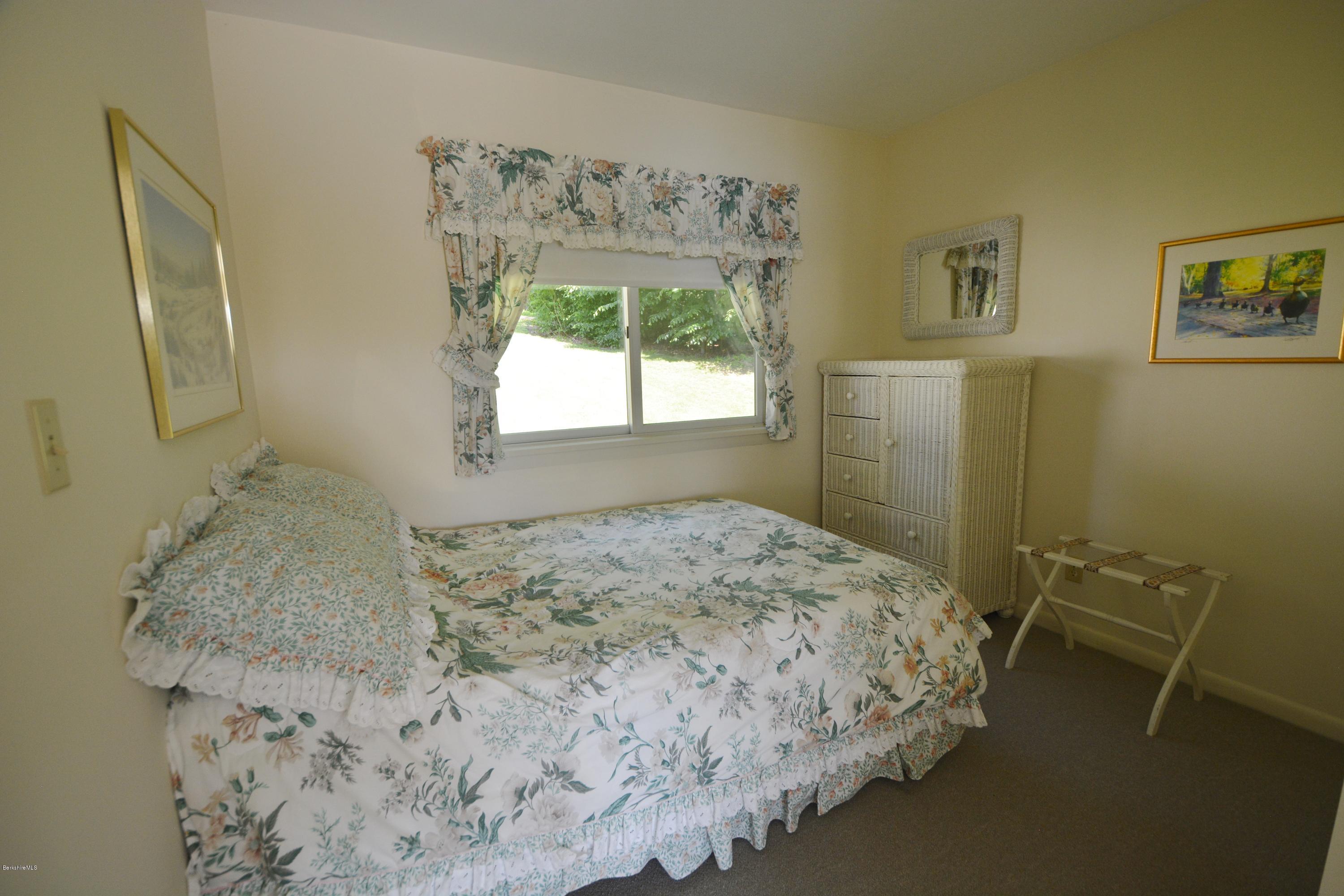 633 Pine Road Otis, MA 01029 - Photo 19 of 24 a bedroom with a bed and a window