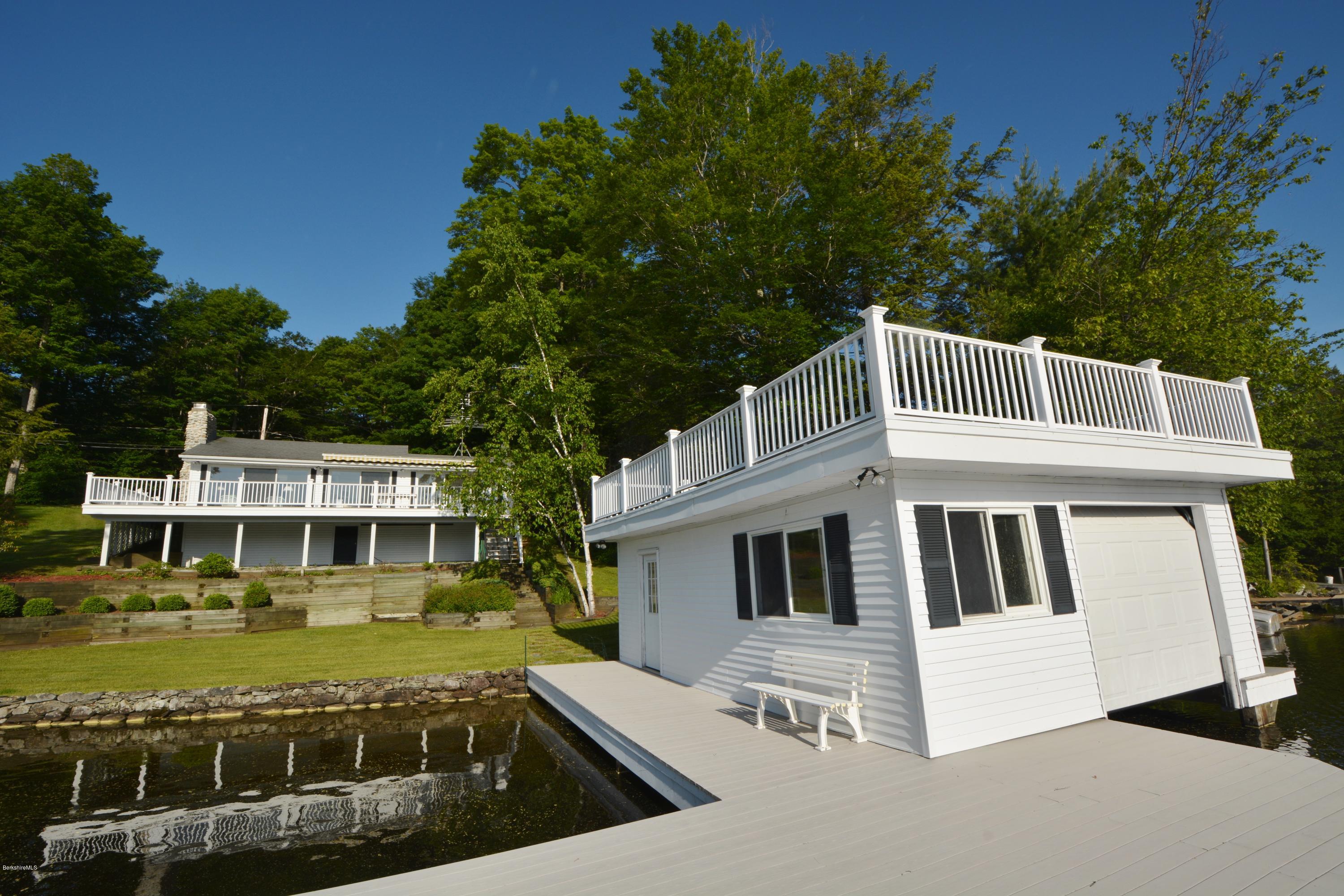 633 Pine Road Otis, MA 01029 - Photo 3 of 24 a view of a house with swimming pool next to a yard