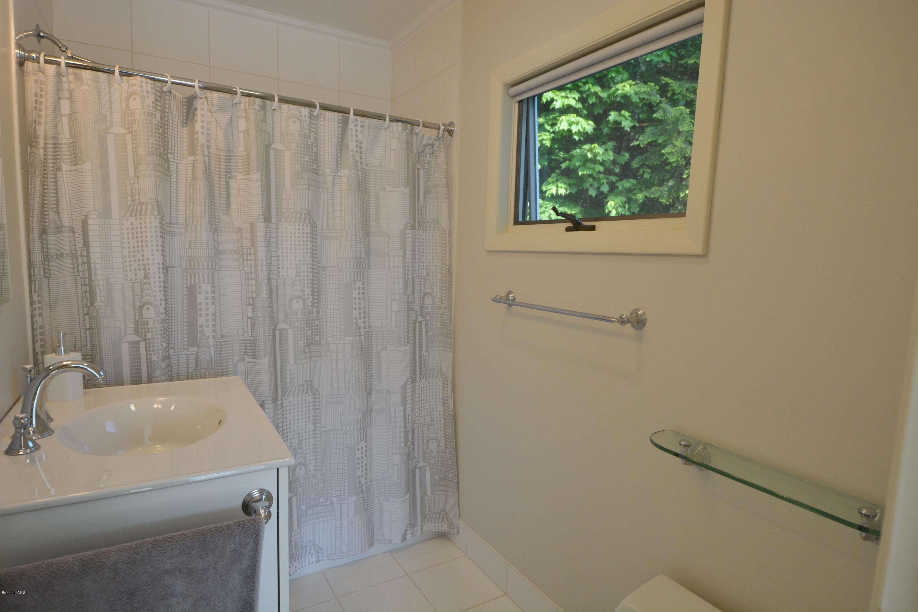 633 Pine Road Otis, MA 01029 - Photo 21 of 24 a bathroom with a sink and a vanity