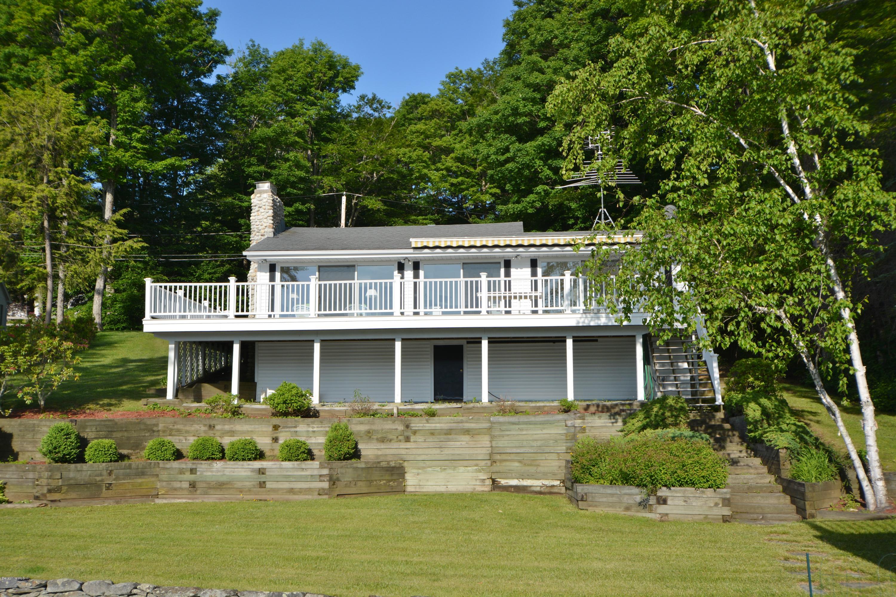 633 Pine Road Otis, MA 01029 - Photo 6 of 24 a front view of a house with a garden