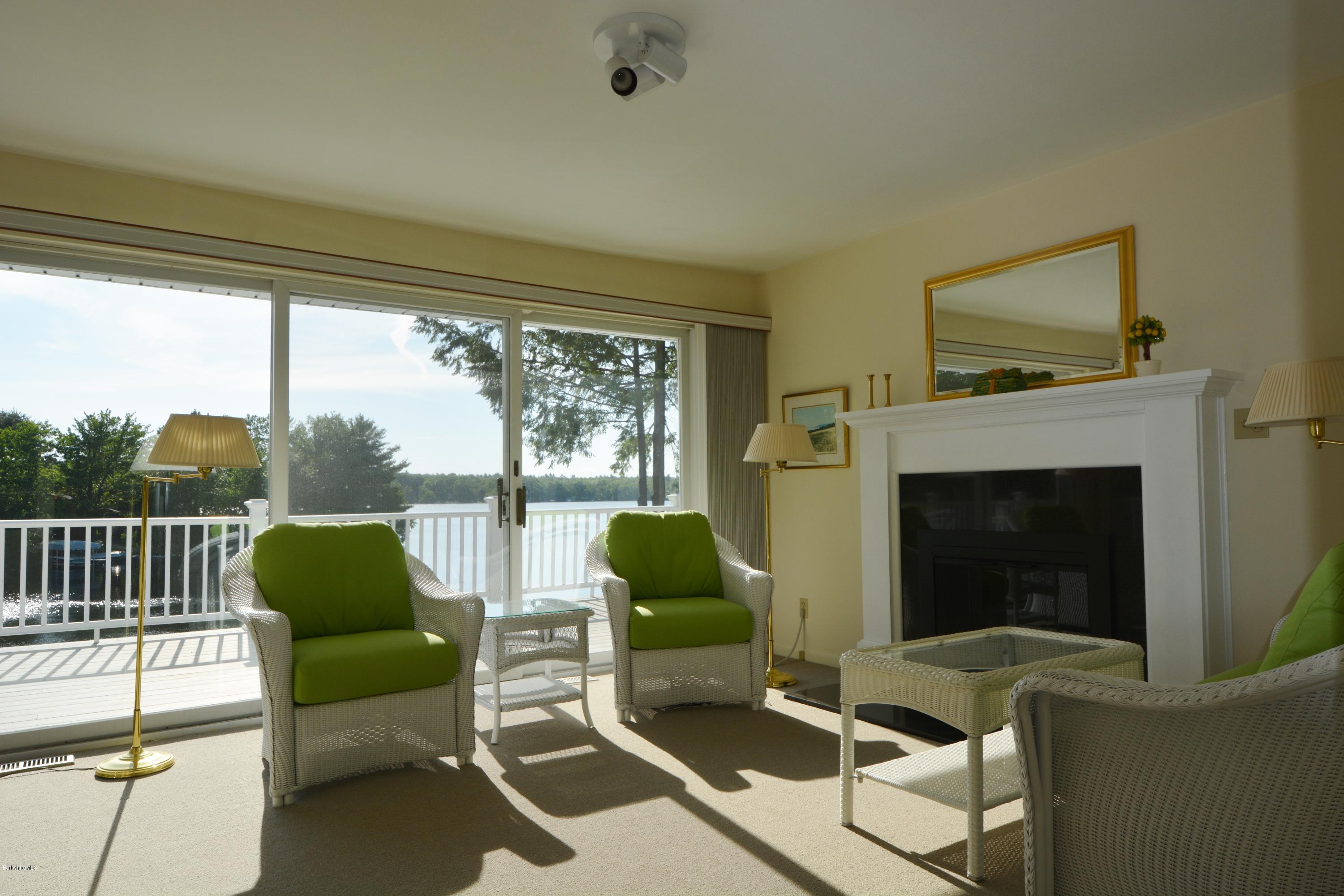 633 Pine Road Otis, MA 01029 - Photo 10 of 24 a living room with furniture and a fireplace