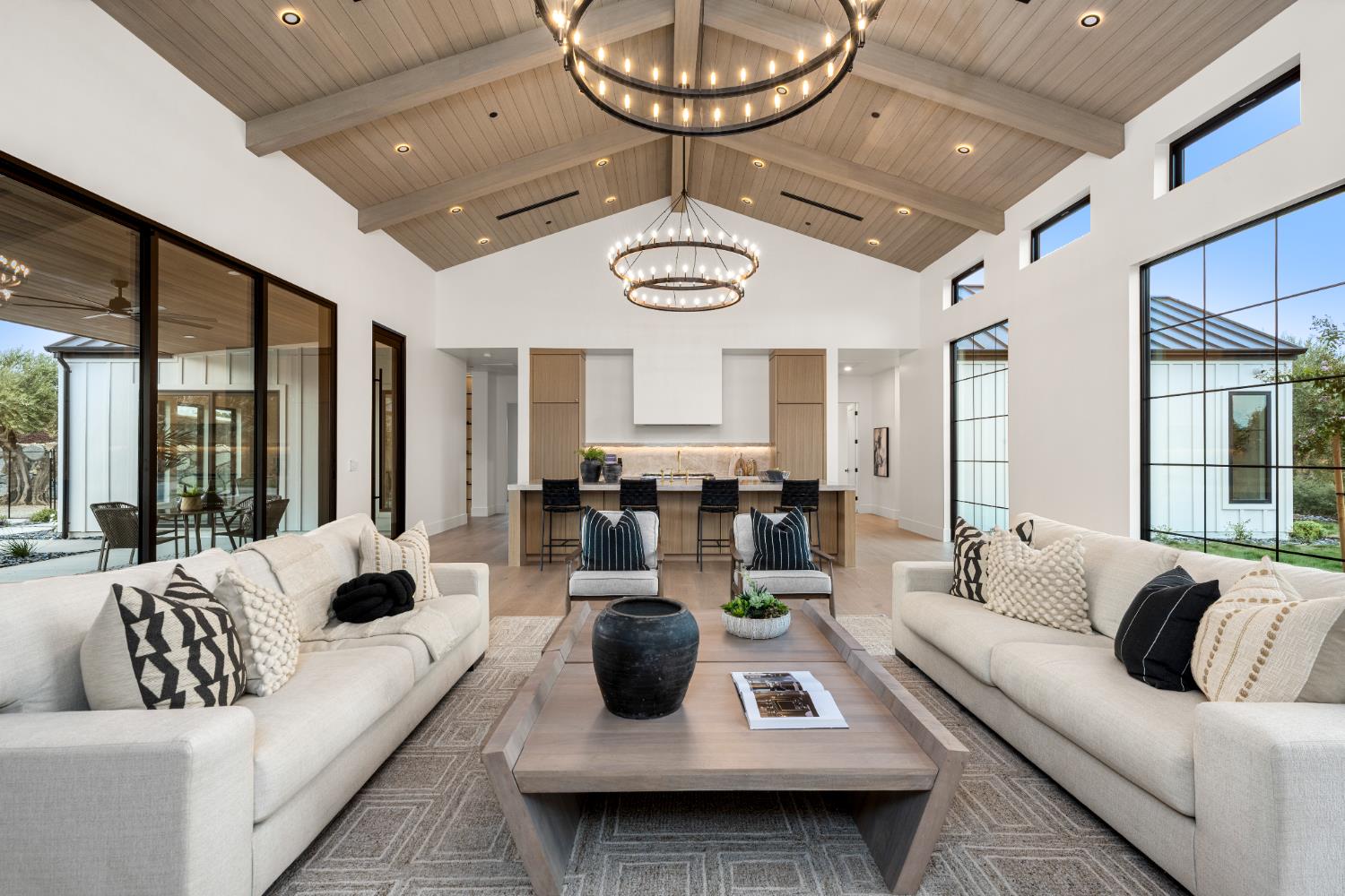 3140 Rattlesnake Road Newcastle, CA 95658 - Photo 21 of 78 a living room with furniture a chandelier and a large window