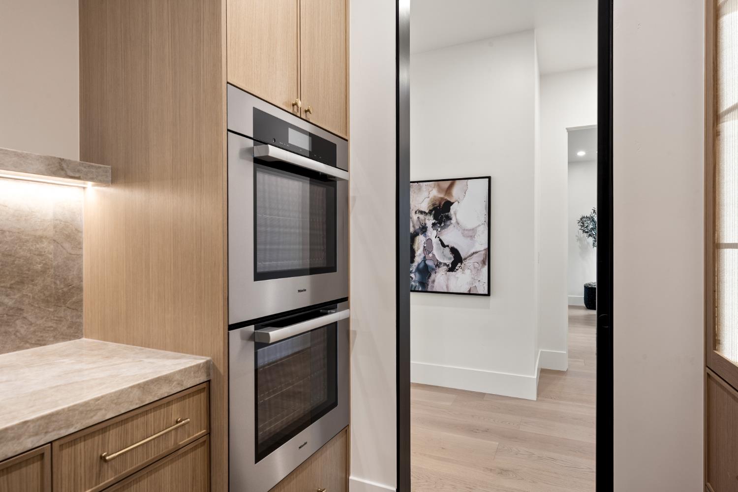 3140 Rattlesnake Road Newcastle, CA 95658 - Photo 26 of 78 a kitchen with a refrigerator and cabinets