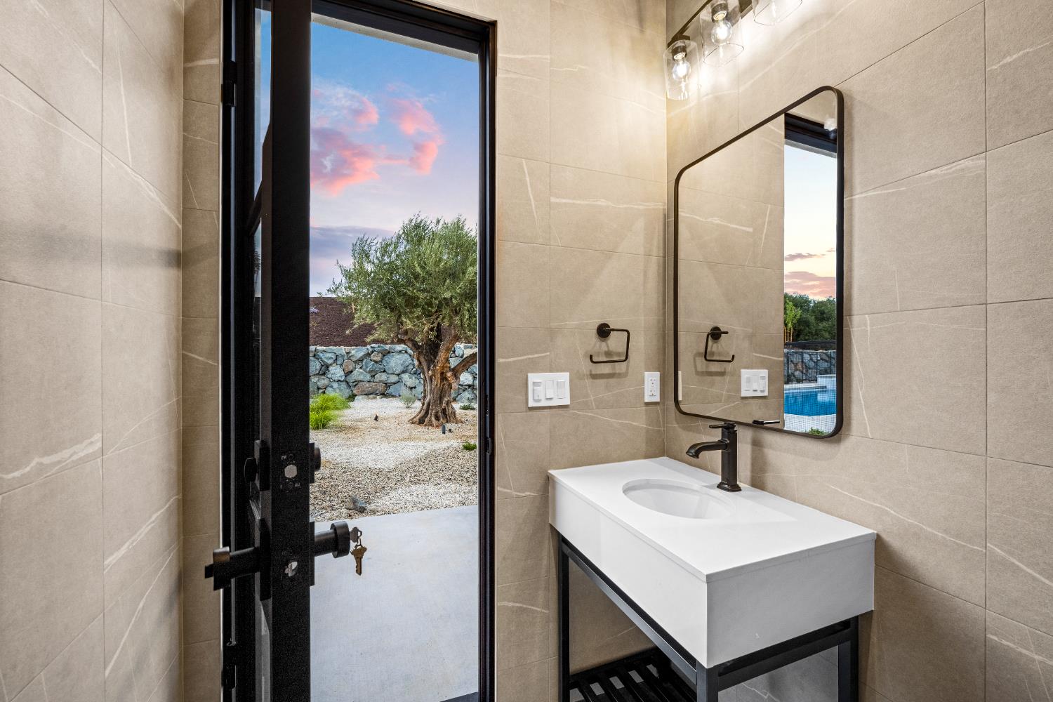 3140 Rattlesnake Road Newcastle, CA 95658 - Photo 54 of 78 a bathroom with a sink a mirror and a shower