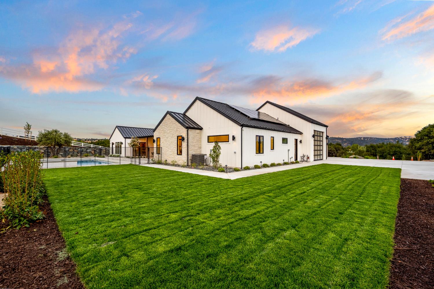 3140 Rattlesnake Road Newcastle, CA 95658 - Photo 55 of 78 a view of a white house with a big yard plants and large trees