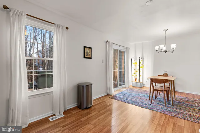 a view of a livingroom with furniture window and wooden floor