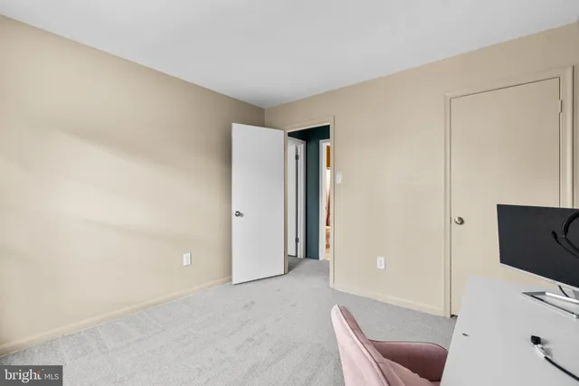 a livingroom with a couch and a flat screen tv