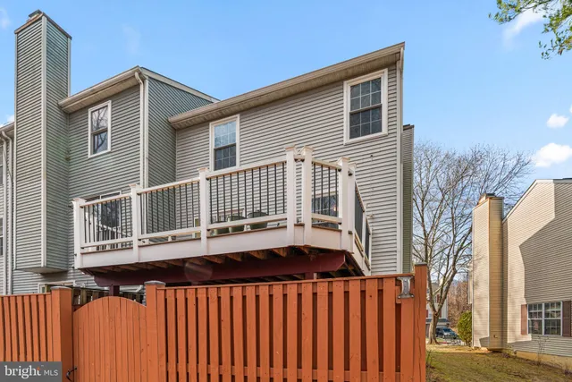 a front view of a house with a deck