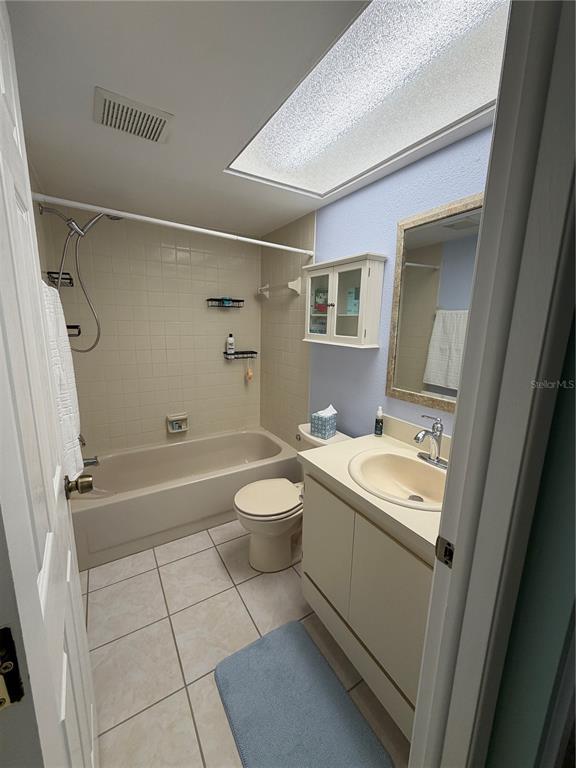 2131 Ridge Road South, Unit 135 Largo, FL 33778 - Photo 18 of 33 a bathroom with a sink a toilet and shower