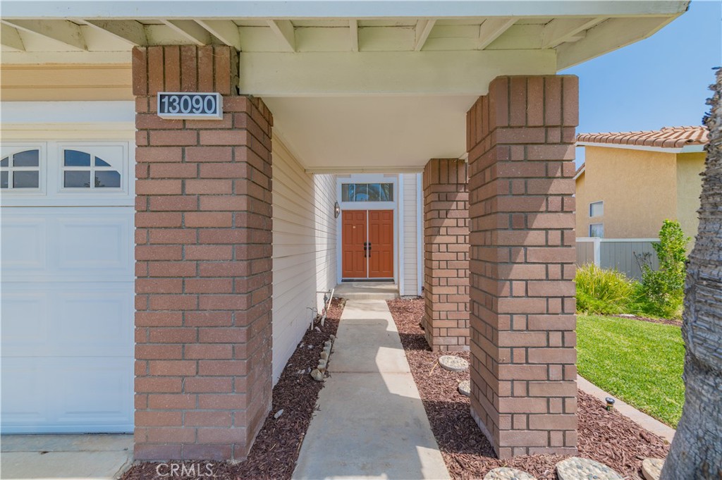 13090 Red Corral Drive Corona, CA 92883 - Photo 3 of 39 a view of entryway with a yard