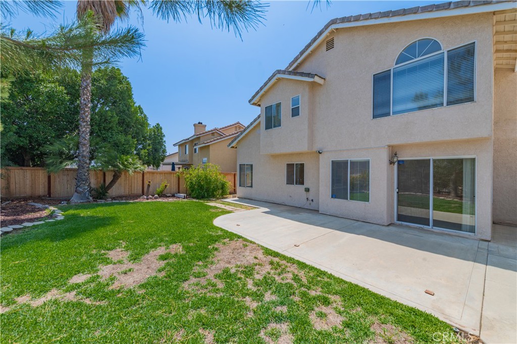 13090 Red Corral Drive Corona, CA 92883 - Photo 36 of 39 a front view of a house with a yard and garage