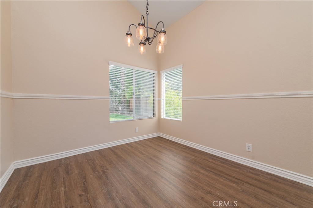 13090 Red Corral Drive Corona, CA 92883 - Photo 7 of 39 wooden floor in an empty room with a window