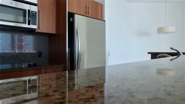 a bathroom with a shower and a microwave