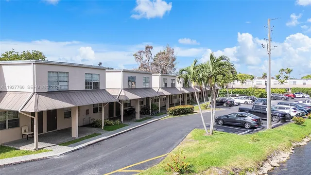 a view of a house with backyard porch and sitting area