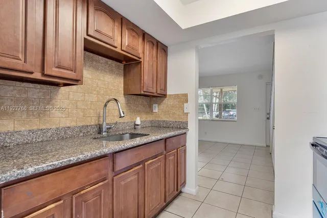 a bathroom with a sink a toilet and a bathtub
