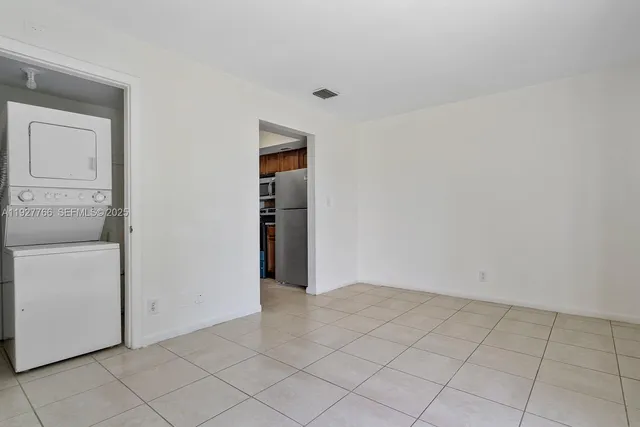 a bathroom with a granite countertop sink and vanity