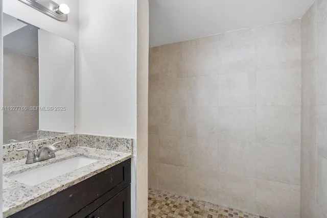 a spacious bathroom with a toilet and a shower