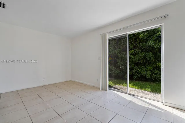 a bathroom with a granite countertop sink and a shower