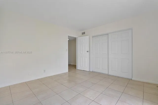 a view of a hallway with some storage area