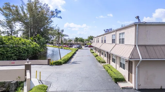 a view of a house with entrance and yard
