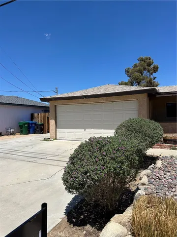 a view of a house with a street