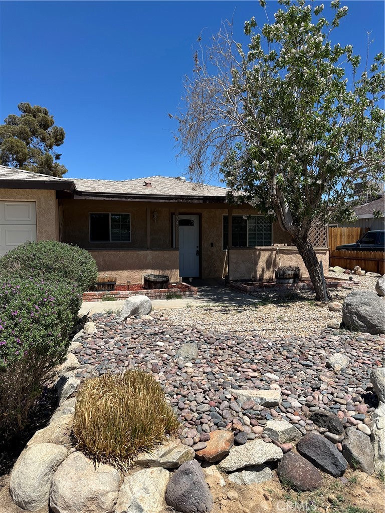 740 West Church Avenue Ridgecrest, CA 93555 - Photo 2 of 12 a front view of a house with a yard