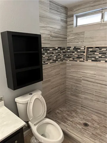 a bathroom with a toilet and a sink