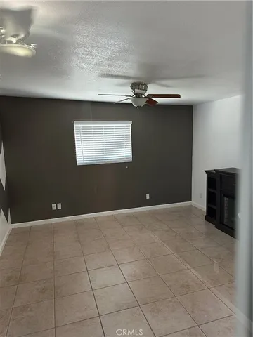 a view of an empty room with a fireplace