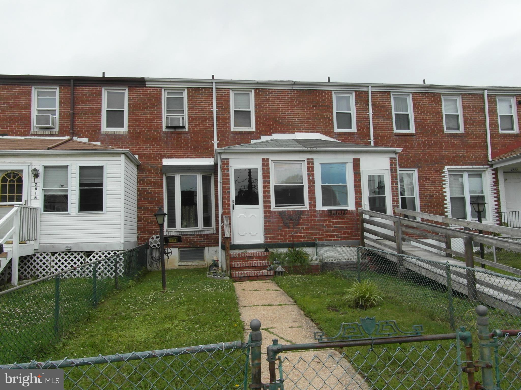 7818 New Battle Grove Road Baltimore, MD 21222 - Photo 1 of 13 a front view of a house with a yard