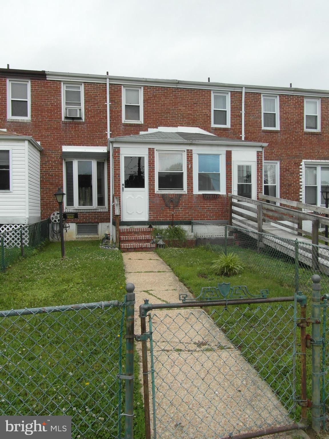 7818 New Battle Grove Road Baltimore, MD 21222 - Photo 2 of 13 a front view of a house with a yard