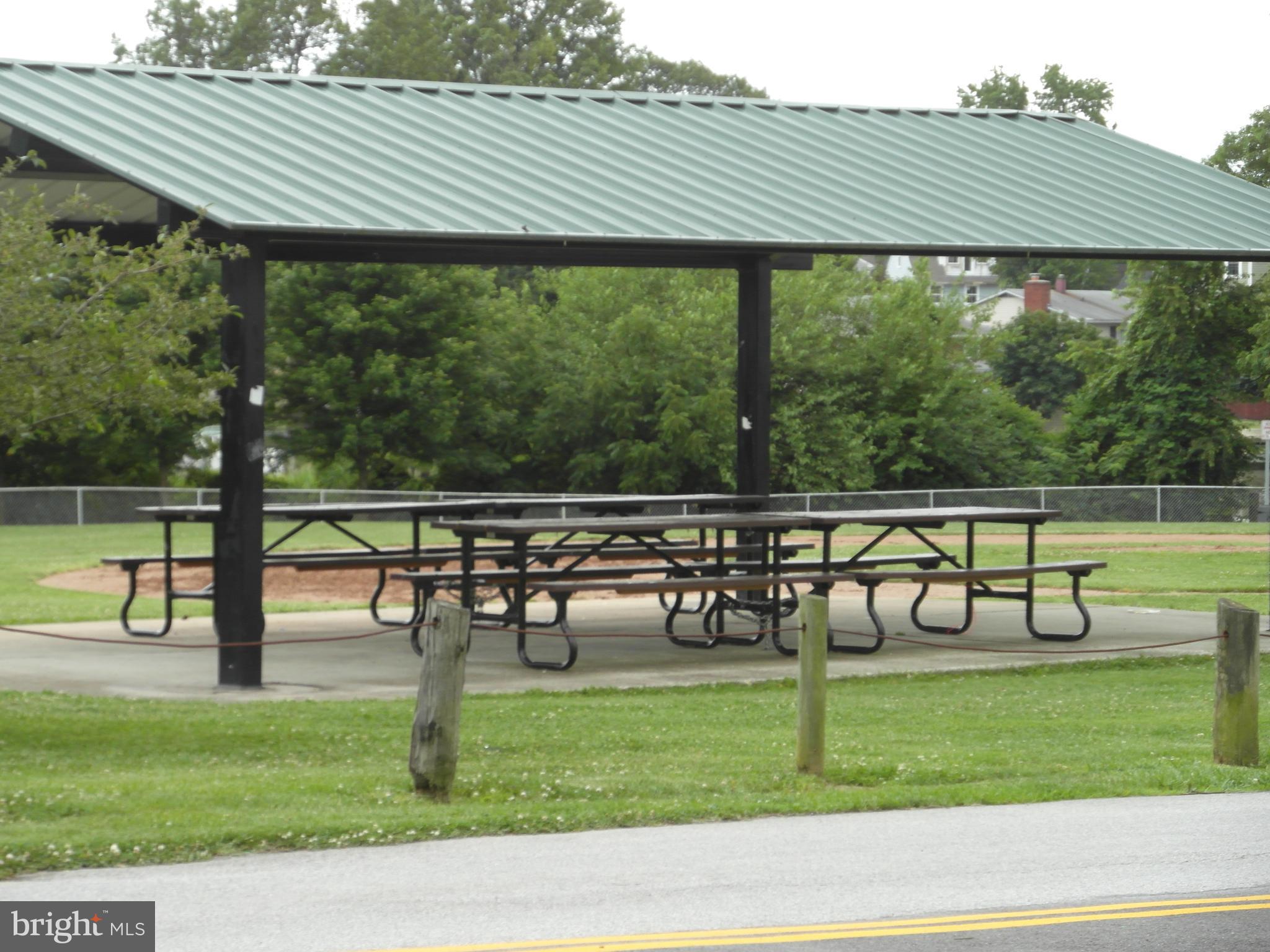 7818 New Battle Grove Road Baltimore, MD 21222 - Photo 5 of 13 a view of a chairs and table in the yard