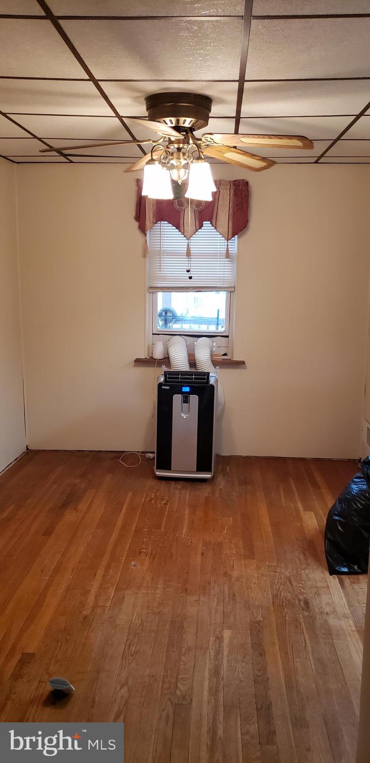 7818 New Battle Grove Road Baltimore, MD 21222 - Photo 9 of 13 a view of a room with racks on the wall