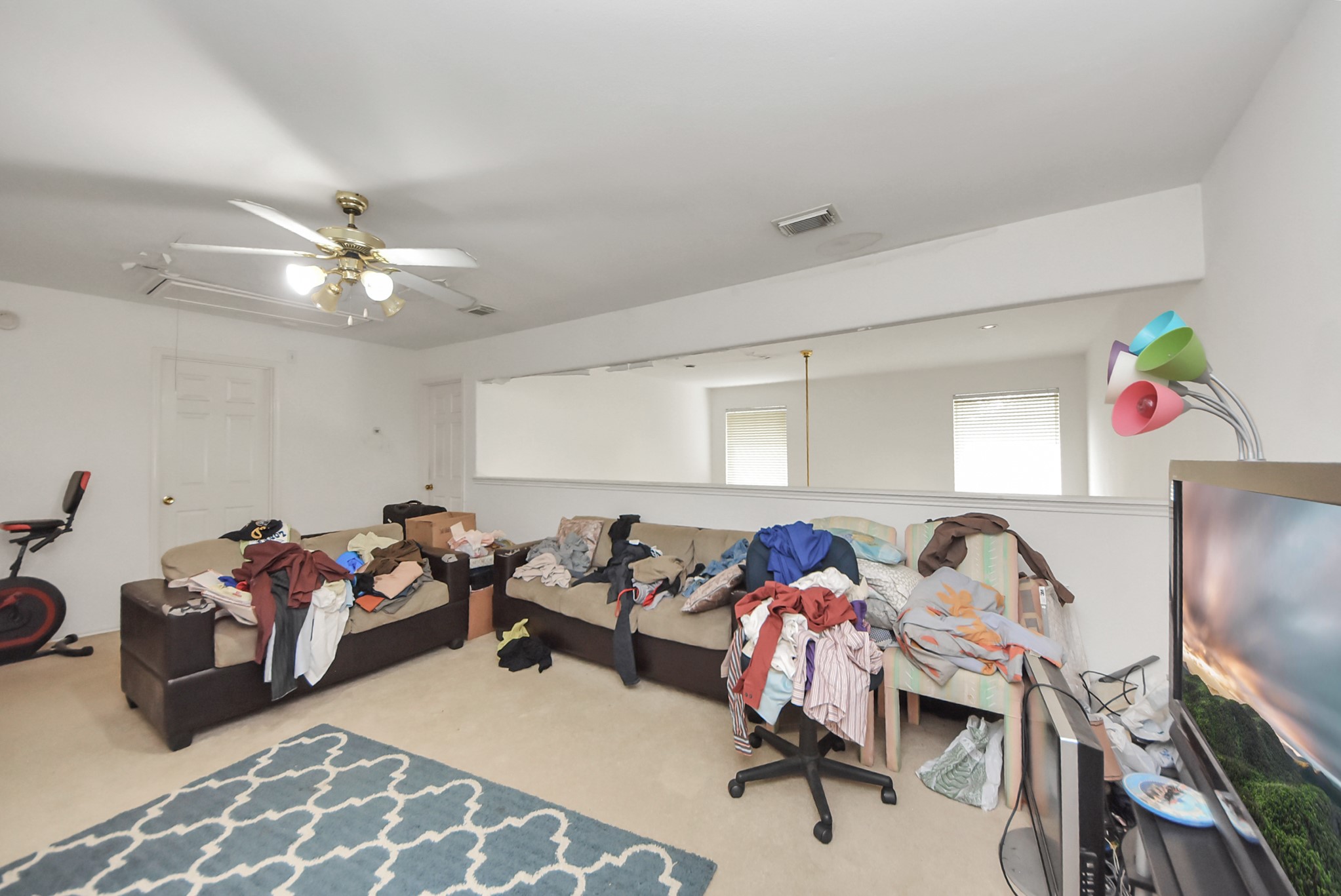 10003 Dakota Ridge Court Houston, TX 77095 - Photo 17 of 30 a bed room with furniture and a flat screen tv