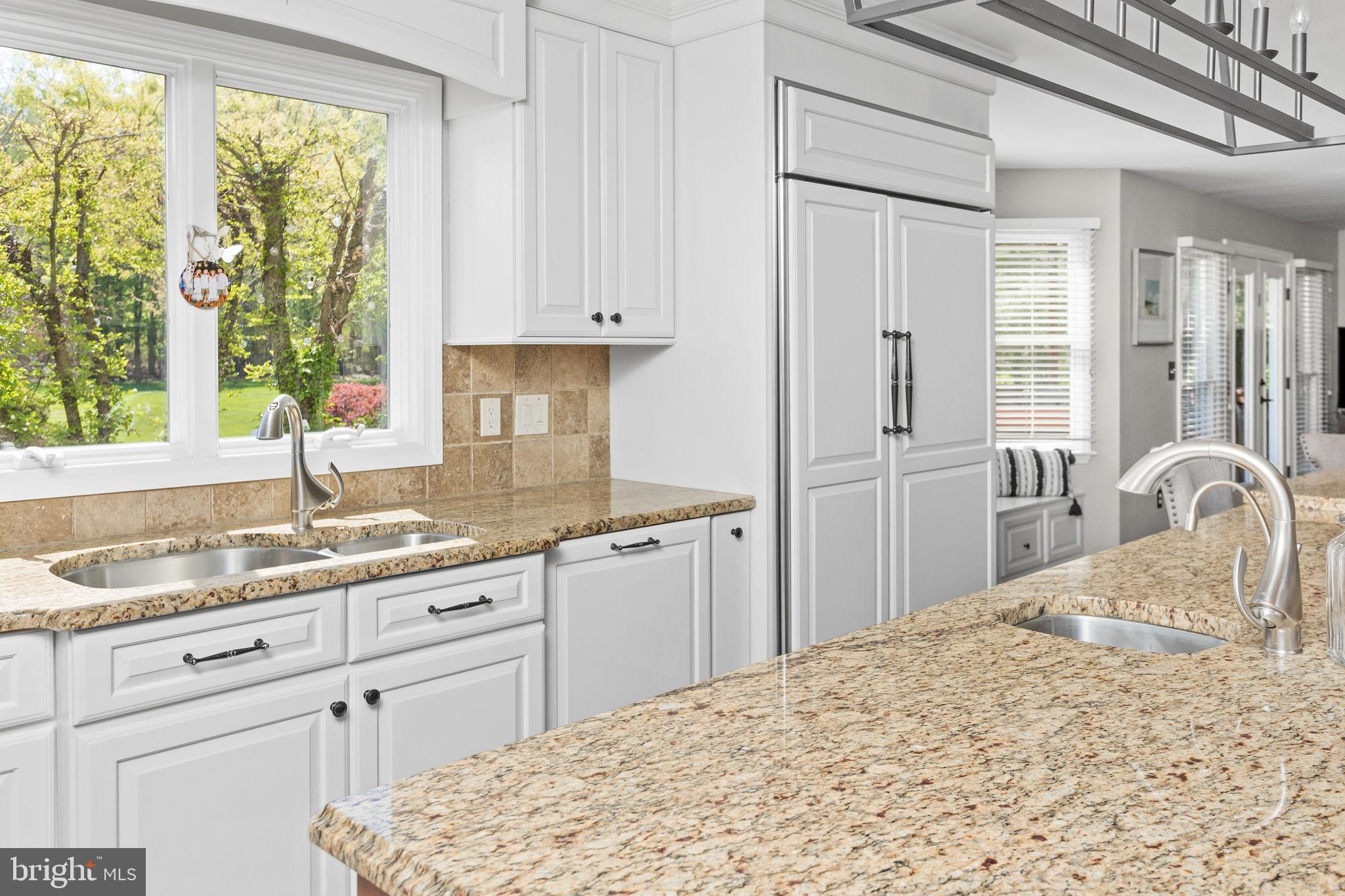 44 Walters Road Robbinsville, NJ 08691 - Photo 22 of 68 a kitchen with granite countertop a sink stainless steel appliances cabinets and a large window