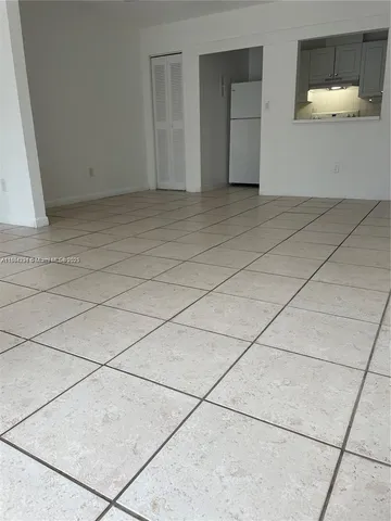 a view of a livingroom with a dishwasher and a stove top oven