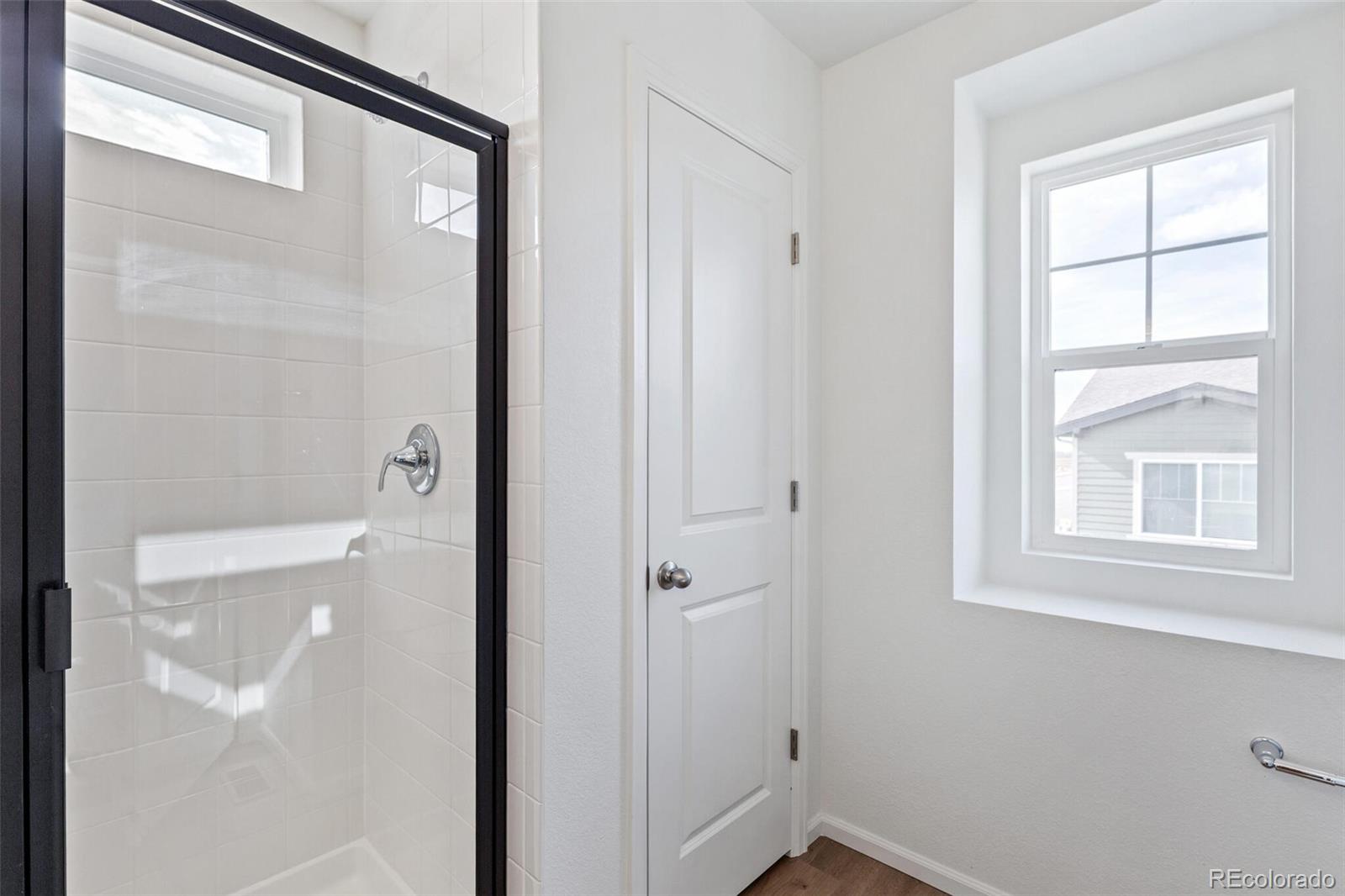 28636 East 6th Place Watkins, CO 80137 - Photo 22 of 32 a bathroom with a shower