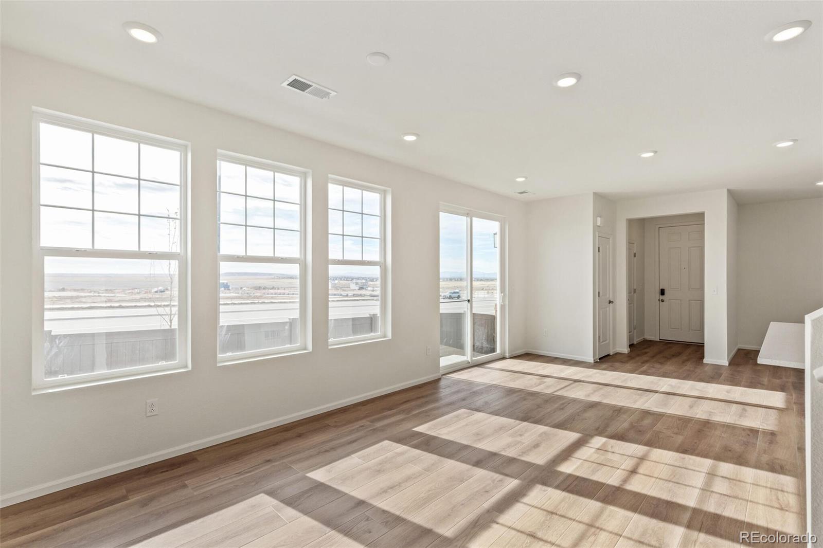 28636 East 6th Place Watkins, CO 80137 - Photo 4 of 32 a view of an empty room with a window