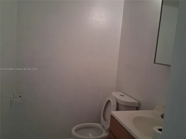 a bathroom with a sink and toilet