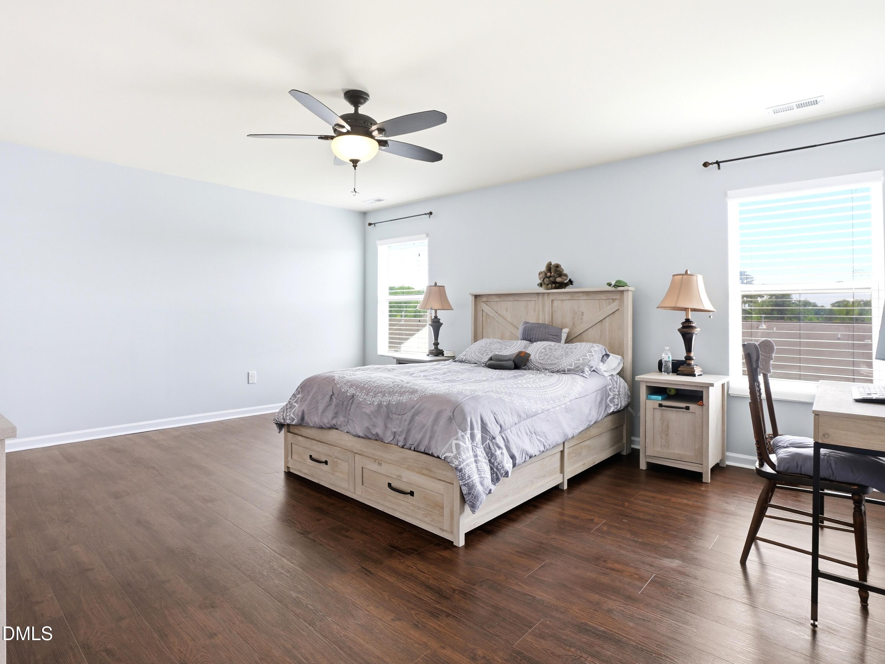 8128 Hovingham Way Raleigh, NC 27616 - Photo 6 of 40 a bedroom with a bed and a chandelier