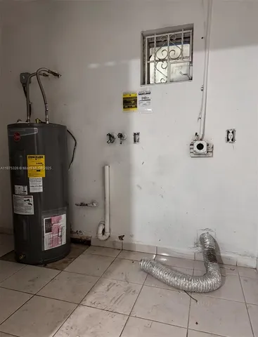 a view of an empty room and a window