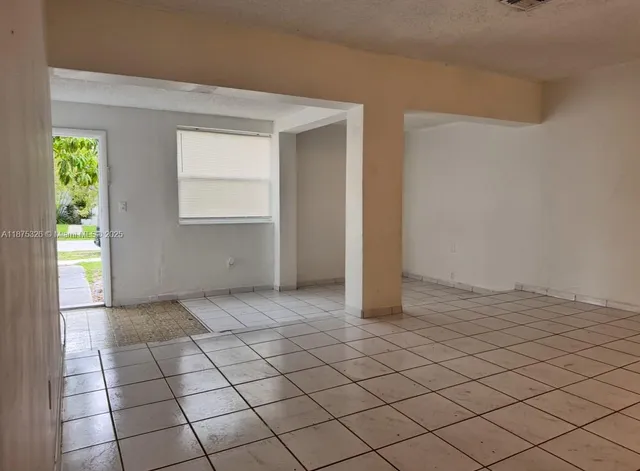a view of an empty room and window
