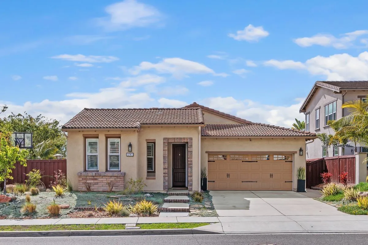3741 Bergen Peak Place Carlsbad, CA 92010 - Photo 1 of 39 a front view of a house with garden