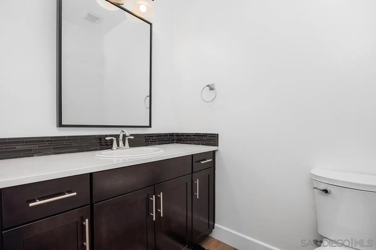 3741 Bergen Peak Place Carlsbad, CA 92010 - Photo 12 of 39 a bathroom with a sink and a mirror