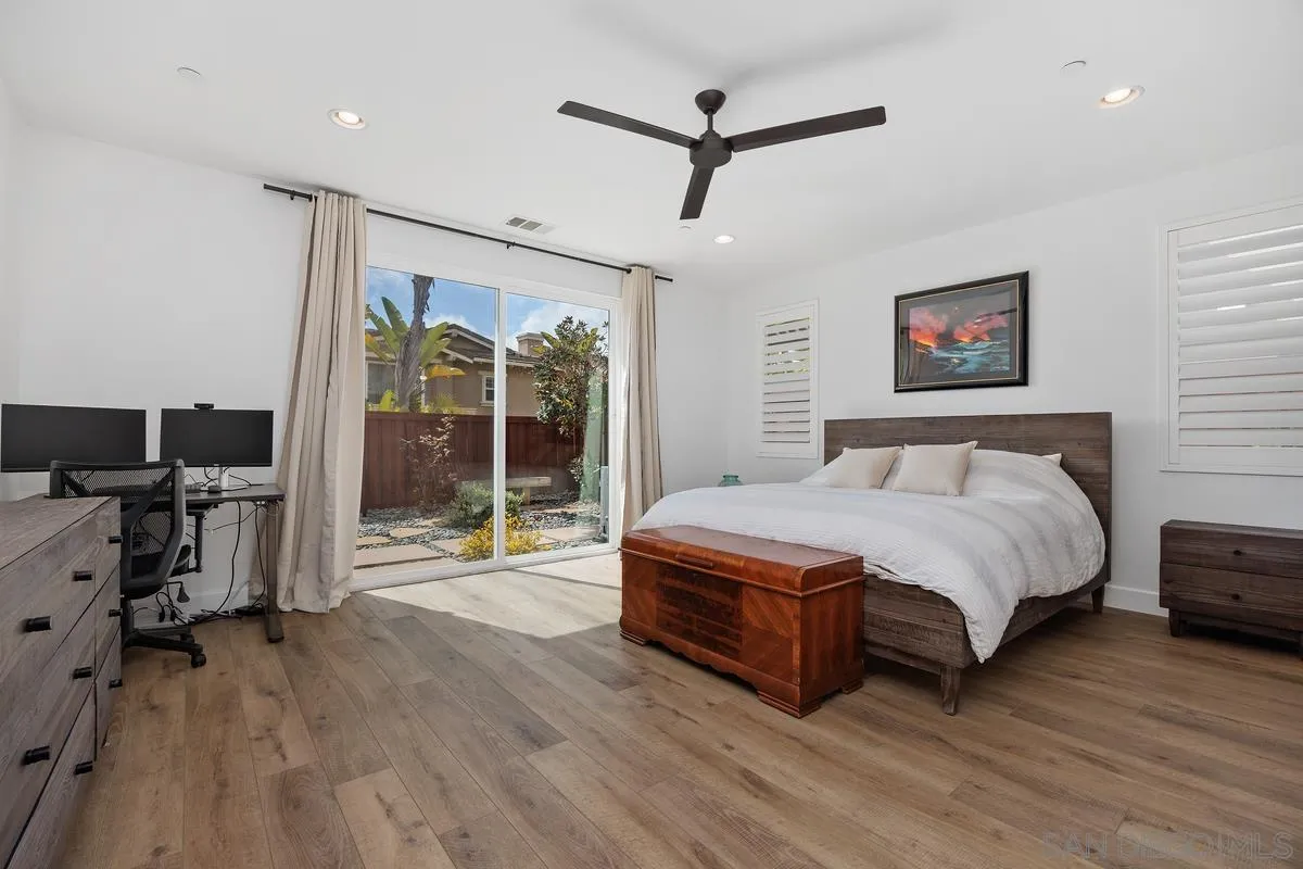 3741 Bergen Peak Place Carlsbad, CA 92010 - Photo 15 of 39 a spacious bedroom with a bed and a flat tv screen on the dresser