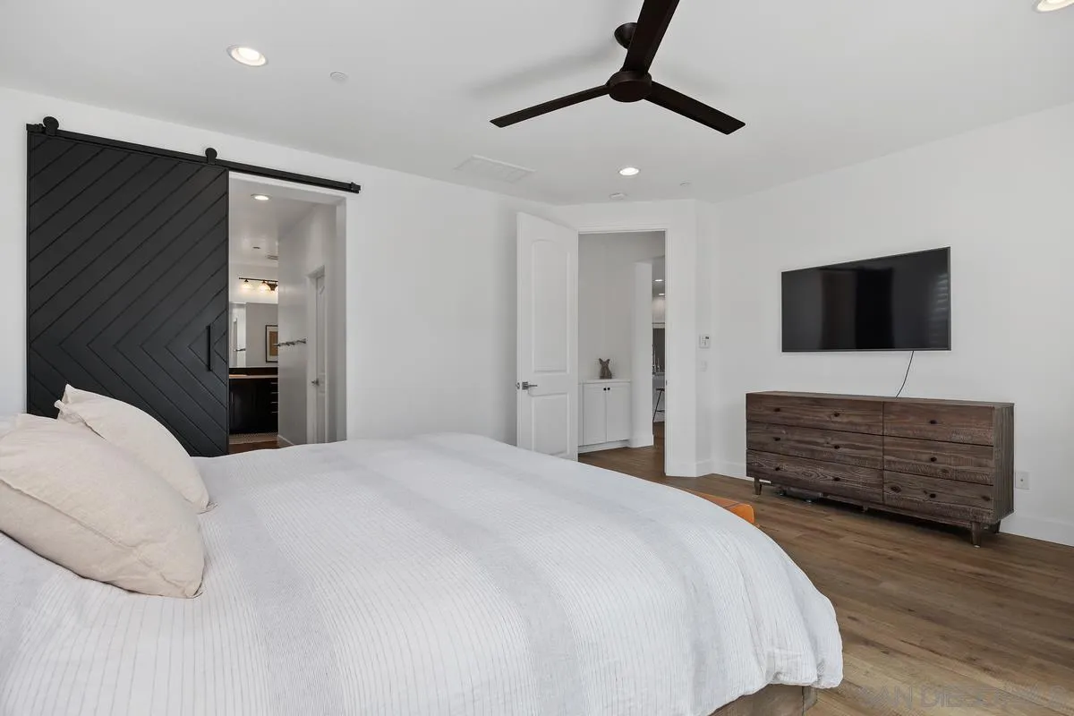3741 Bergen Peak Place Carlsbad, CA 92010 - Photo 16 of 39 a bedroom with furniture and a flat tv screen