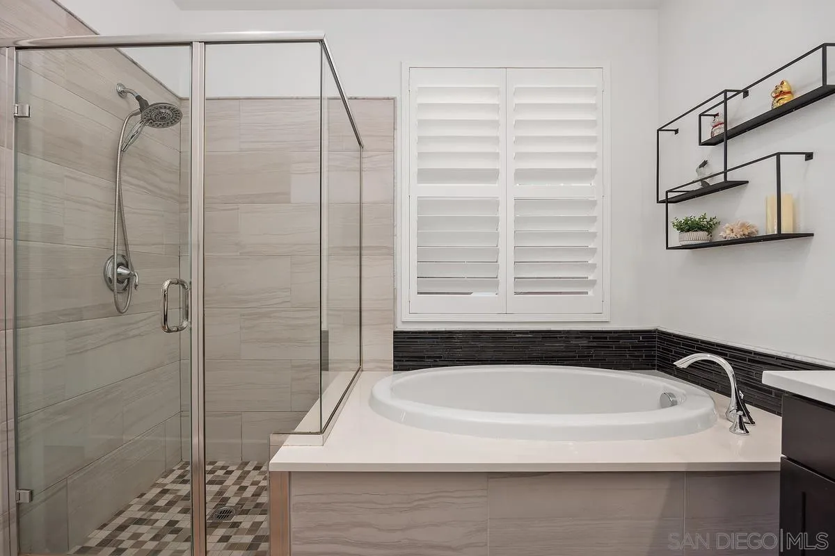 3741 Bergen Peak Place Carlsbad, CA 92010 - Photo 18 of 39 a bathroom with a bathtub and shower