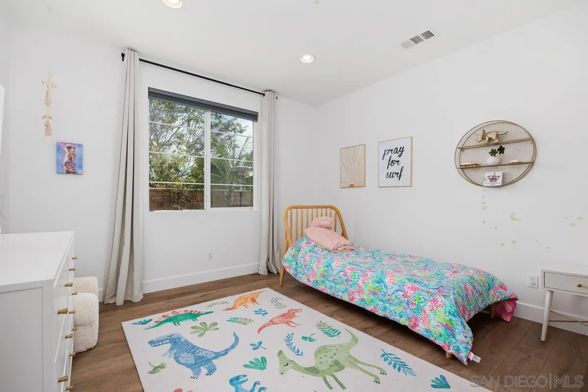 3741 Bergen Peak Place Carlsbad, CA 92010 - Photo 19 of 39 a bedroom with a bed and a window